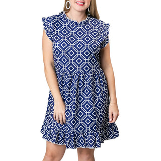 Navy and white octagon print sleeveless dress with ruffle at sleeve, neck and hem,  above-the-knee length