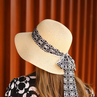 Women wearing poncho and hat