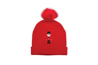 Red knit hat with embroidered nutcrackered 