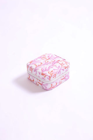 Travel jewelry organizer in pink and orange coral reef-inspired print.