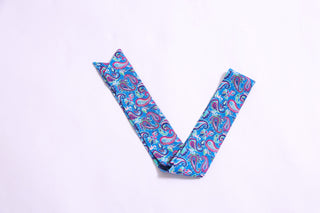 Bright paisley printed twillie scarf in shades of blue, pink, and green.