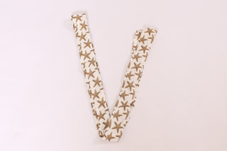 White twillie with gold starfish print, styled for coastal chic accessorizing