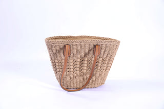 Sandy Shoulder Bag in natural straw with brown shoulder straps and secure zipper closure, lightweight summer tote.