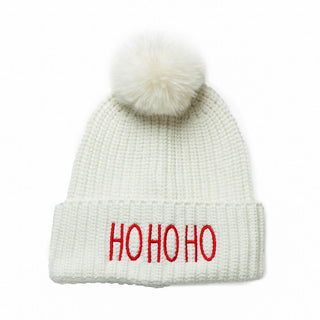 White knit beanie hat with coordinating faux fur pom pom with embroidered red HOHOHO