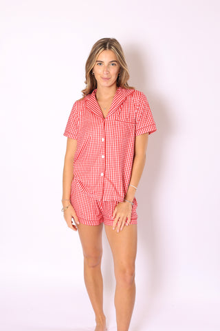 Model in Gracie Gingham Slumber Set – playful red gingham pajama shorts and top.