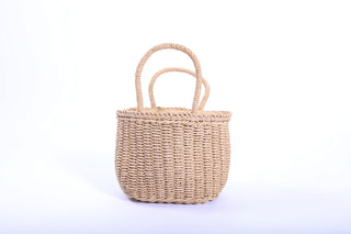 Lani Half Circle Rafia Bag in natural straw color with round handles and drawstring closure.