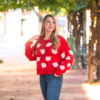 Red sweater with Santa faces