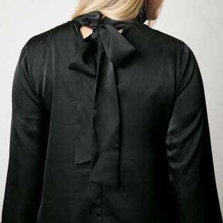 Black dress with ruffle high neck and ribbon tie in the back