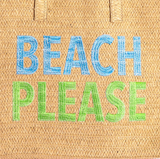 Palma Tote Bag made from eco-friendly straw, featuring bold black embroidered “BEACH PLEASE” text - closeup view.