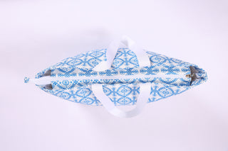 Blue Geometric Print Tote (Top View) – Spring 2026 tote with blue and white geometric print, shown with zipper closure.