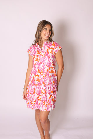 Model in Bonnie Collared Dress featuring blue geometric print, collared button-front, and short sleeves.