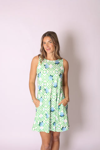 Sophia Dress in Green Geometric Hydrangea print, wrinkle-resistant fabric with pockets.