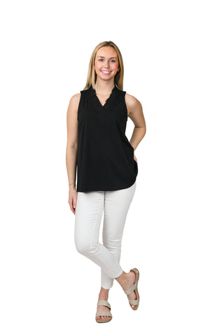 Black Sunny Top blouse with ruffle V-neck paired with white pants