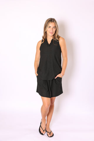 Navy skort styled for tennis with built-in shorts