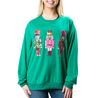 Green sweatshirt with multicolor sequined nutcrackers