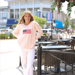 Light pink sweater with American flag patch