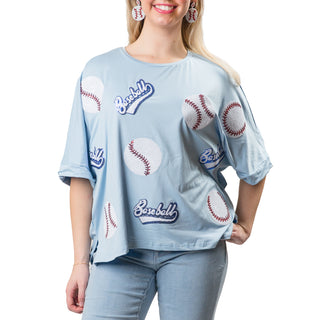 Light blue high-low, round-neck, half-sleeve shirt with sequins baseball patches