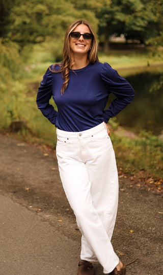 Navy top with long sleeves and puff shoulders