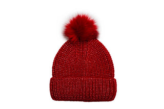 Red knit hat with coordinating pom pom.