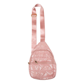 Pink quilted crossbody bag with front pocket