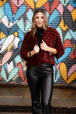 women wearing faux-fur maroon jacket