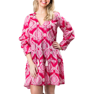 Pink medallion patterned tiered long sleeve tunic dress with a split neck and tassel ties