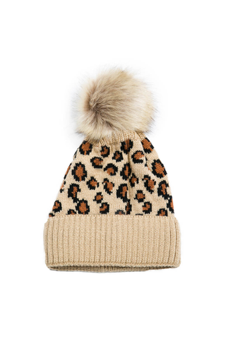 Beige knit beanie with leopard print pattern and faux fur pom-pom on a white background