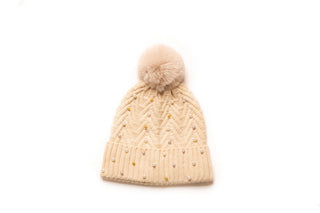 Camel knit hat with pom-pom decorated with pearls and gold balls.