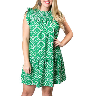Green and white octagon print dress with cap flutter sleeves, smocked above the chest