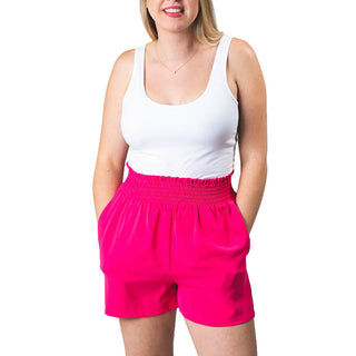 Hot Pink colored loose shorts with high-waisted stretchy elastic waistband 