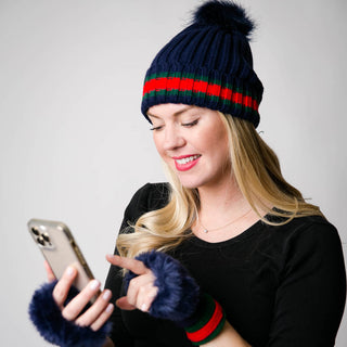 Navy Taryn knit fingerless glove with faux fur trim at fingers and green and red trim at cuff and matching hat